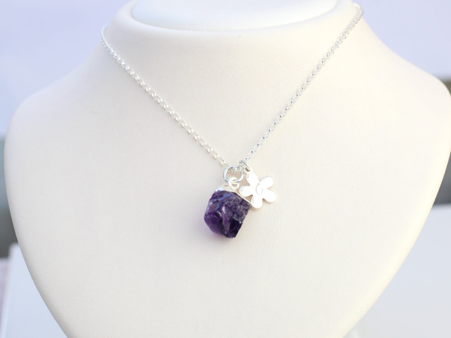 Amethyst initial necklace in sterling silver.