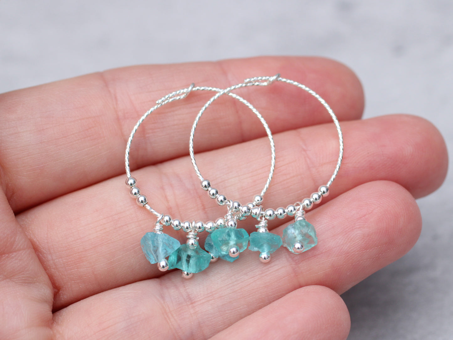 Raw apatite hoop earrings in sterling silver.