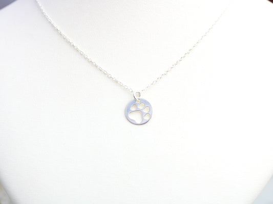 Silver paw print necklace.