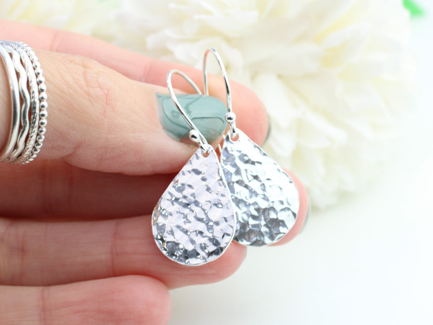 Hammered teardrop earrings in sterling silver.