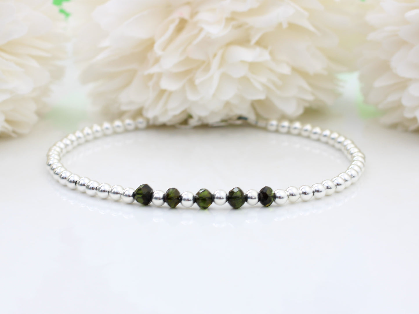 Black tourmaline milestone bracelet in sterling silver.