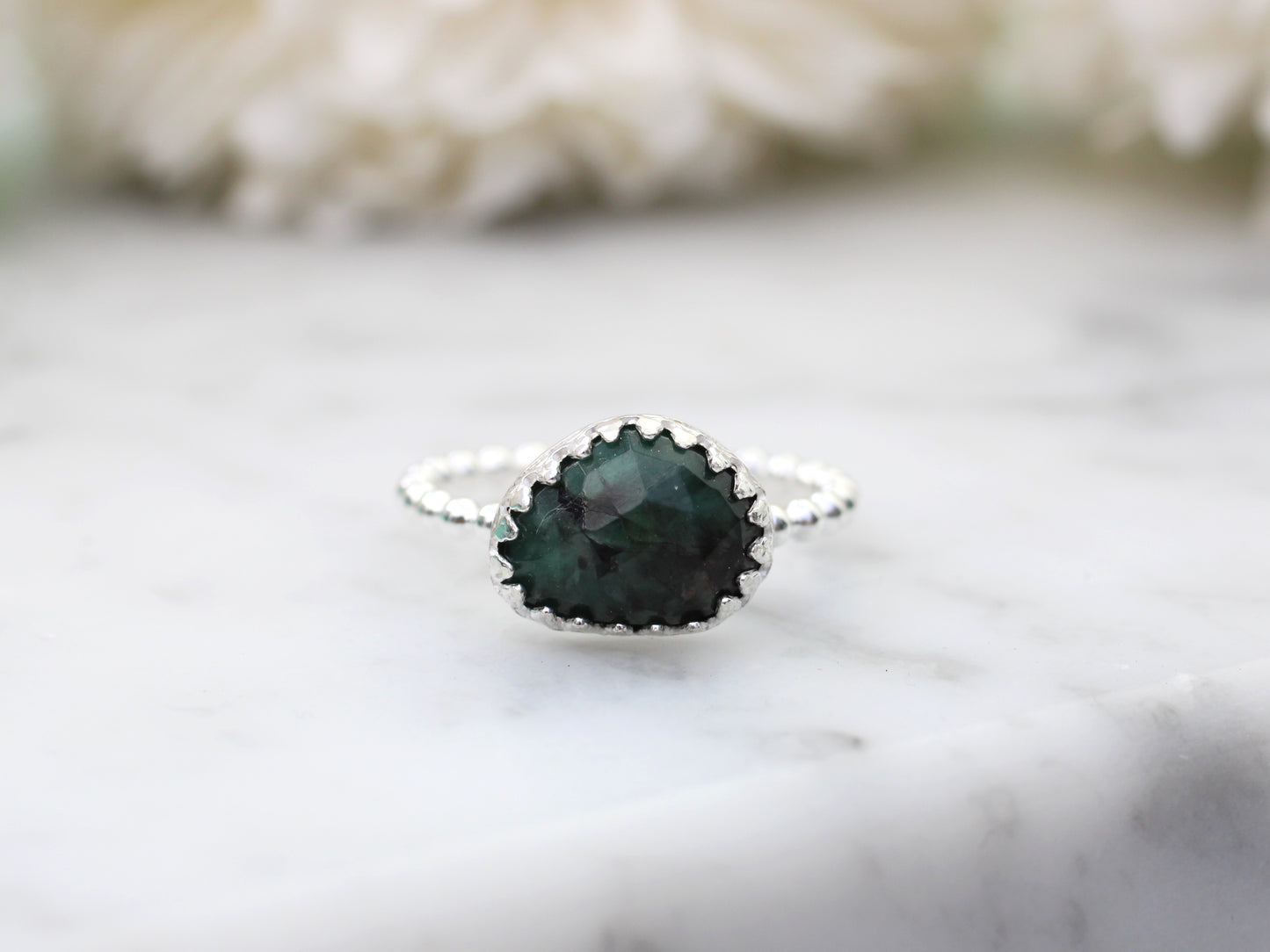 Natural emerald gemstone ring.