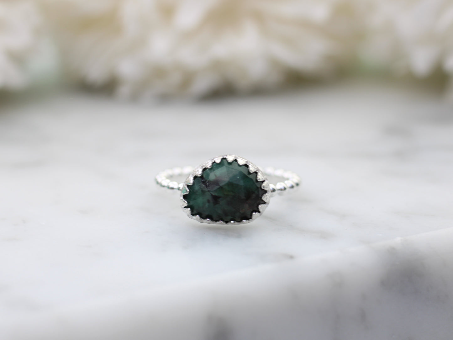 Natural emerald gemstone ring.