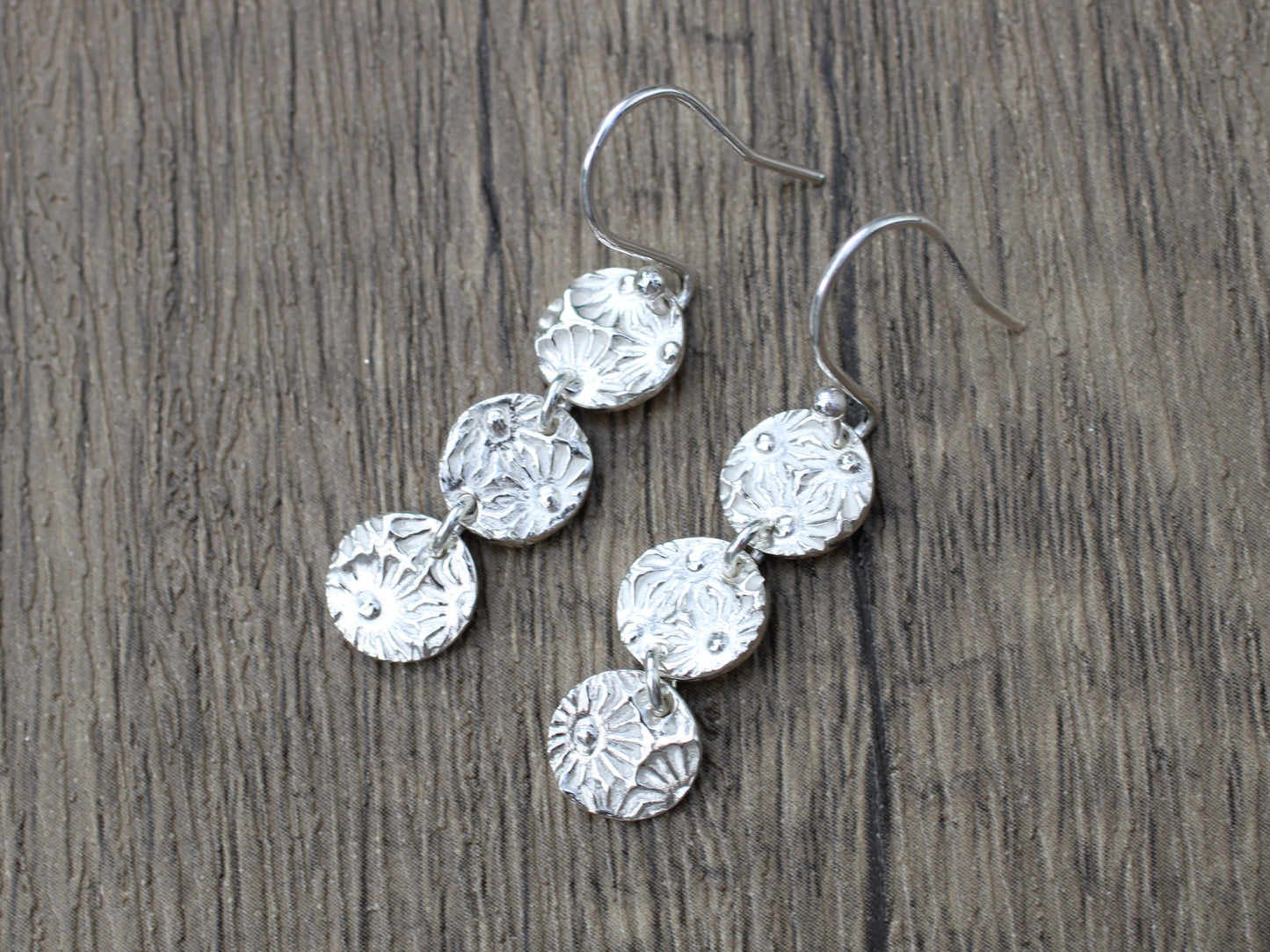 Daisy drop earrings.