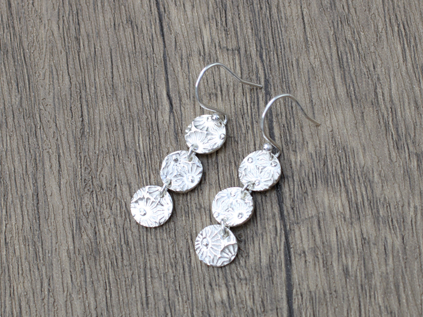 Daisy drop earrings.