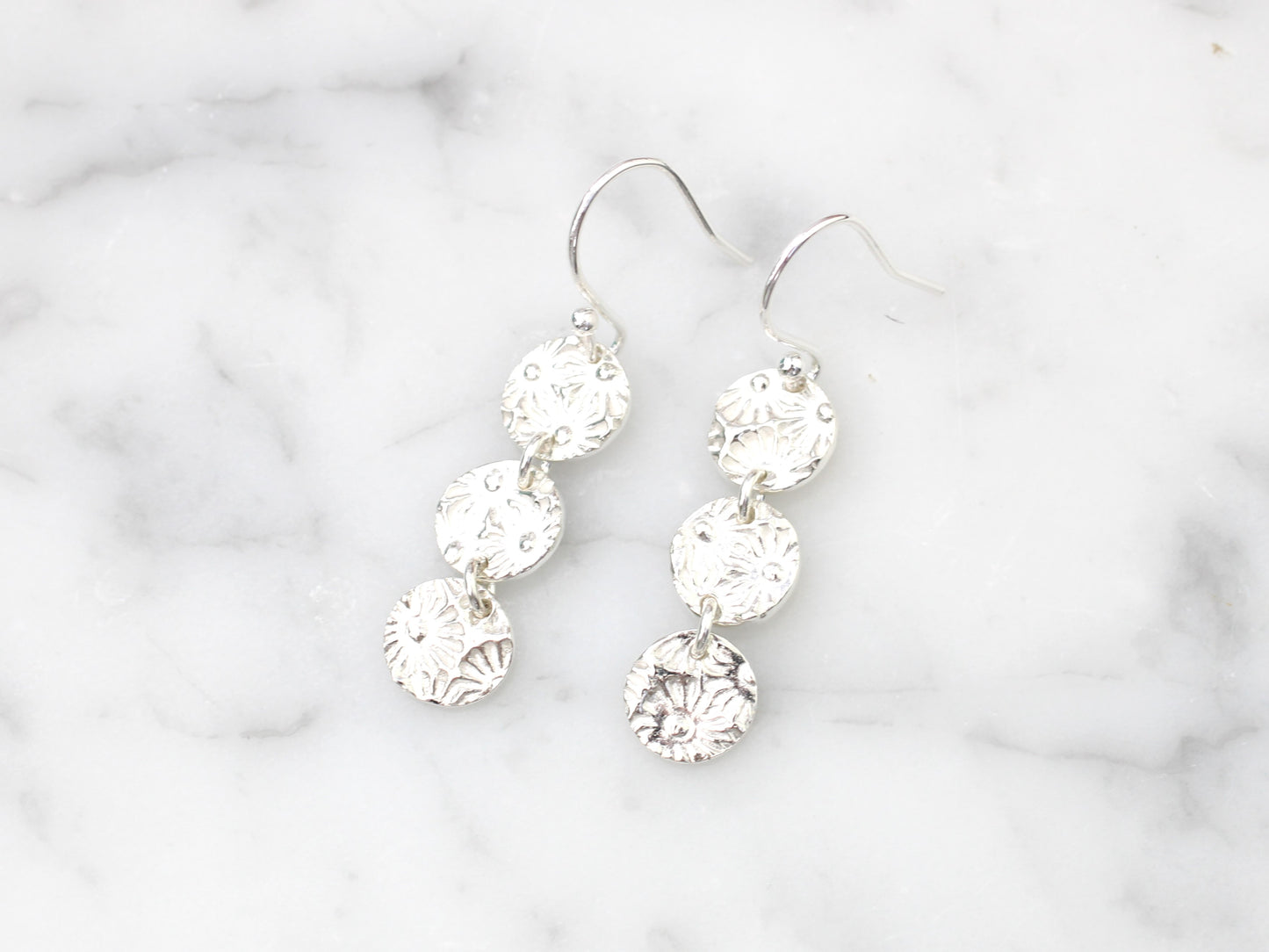 Daisy drop earrings.