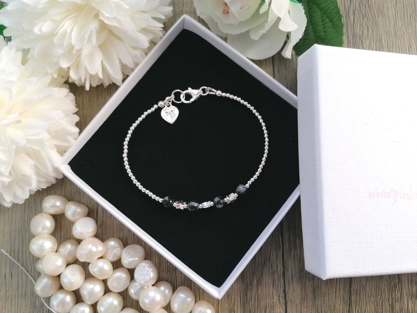 Snowflake obsidian bracelet in sterling silver with optional personalised tag - initial, number or zodiac sign.