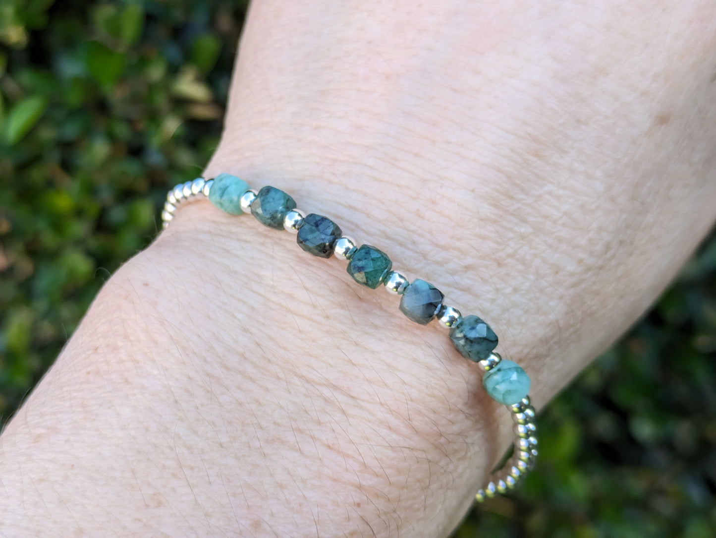 Emerald milestone bracelet in silver.