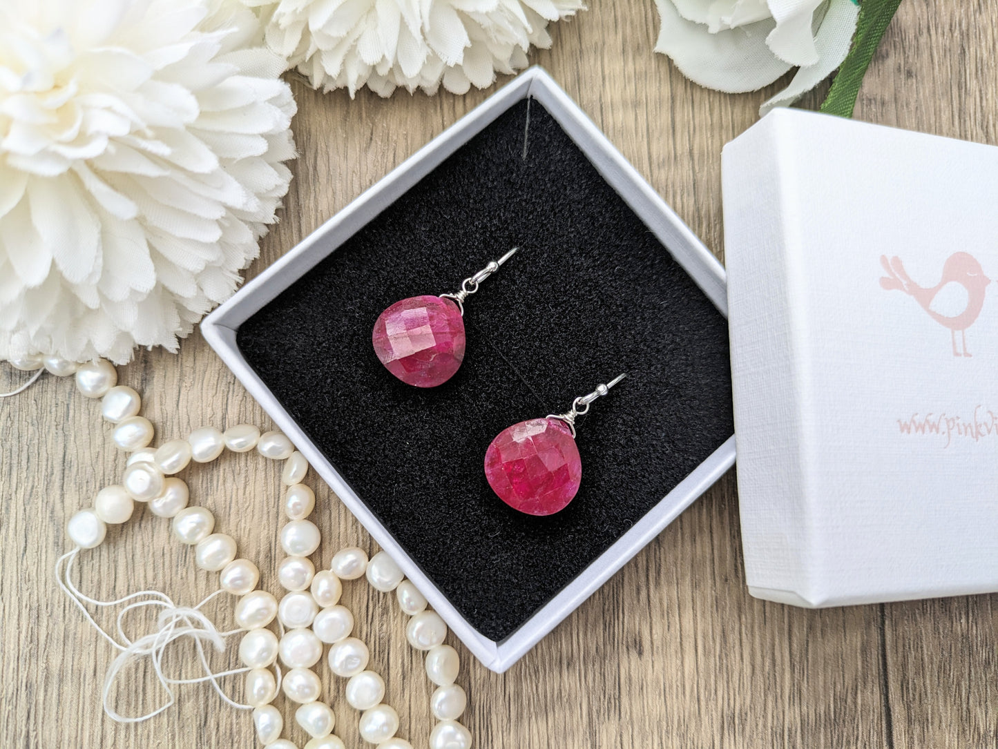 Ruby drop earrings in silver or gold. July birthstone.