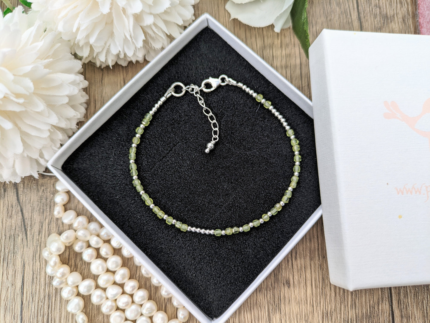 I love you morse code bracelet with peridot gemstones.