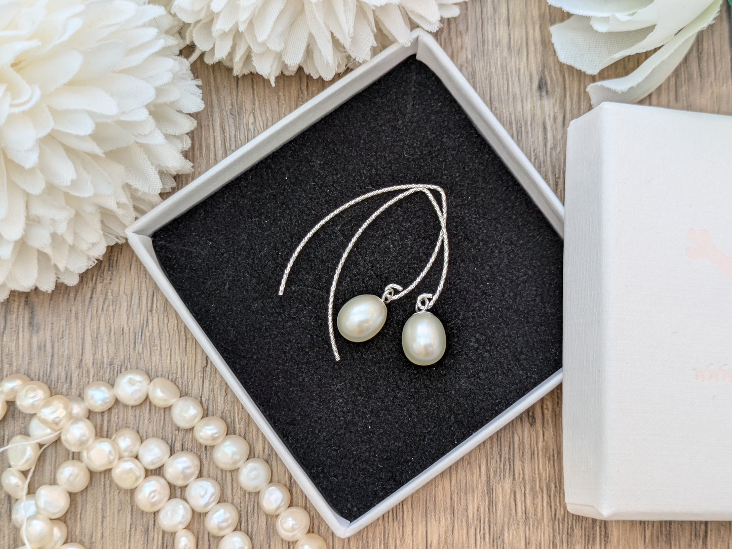 Freshwater pearl drop earrings in silver or gold.