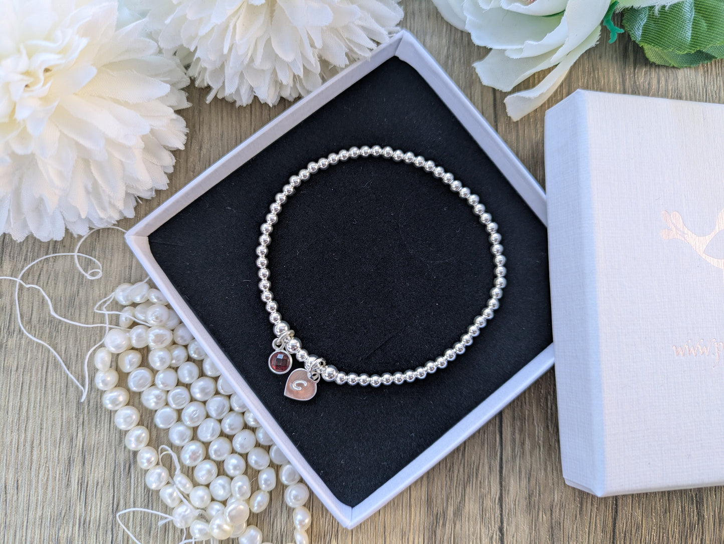 Garnet charm and initial bracelet. January birthstone.