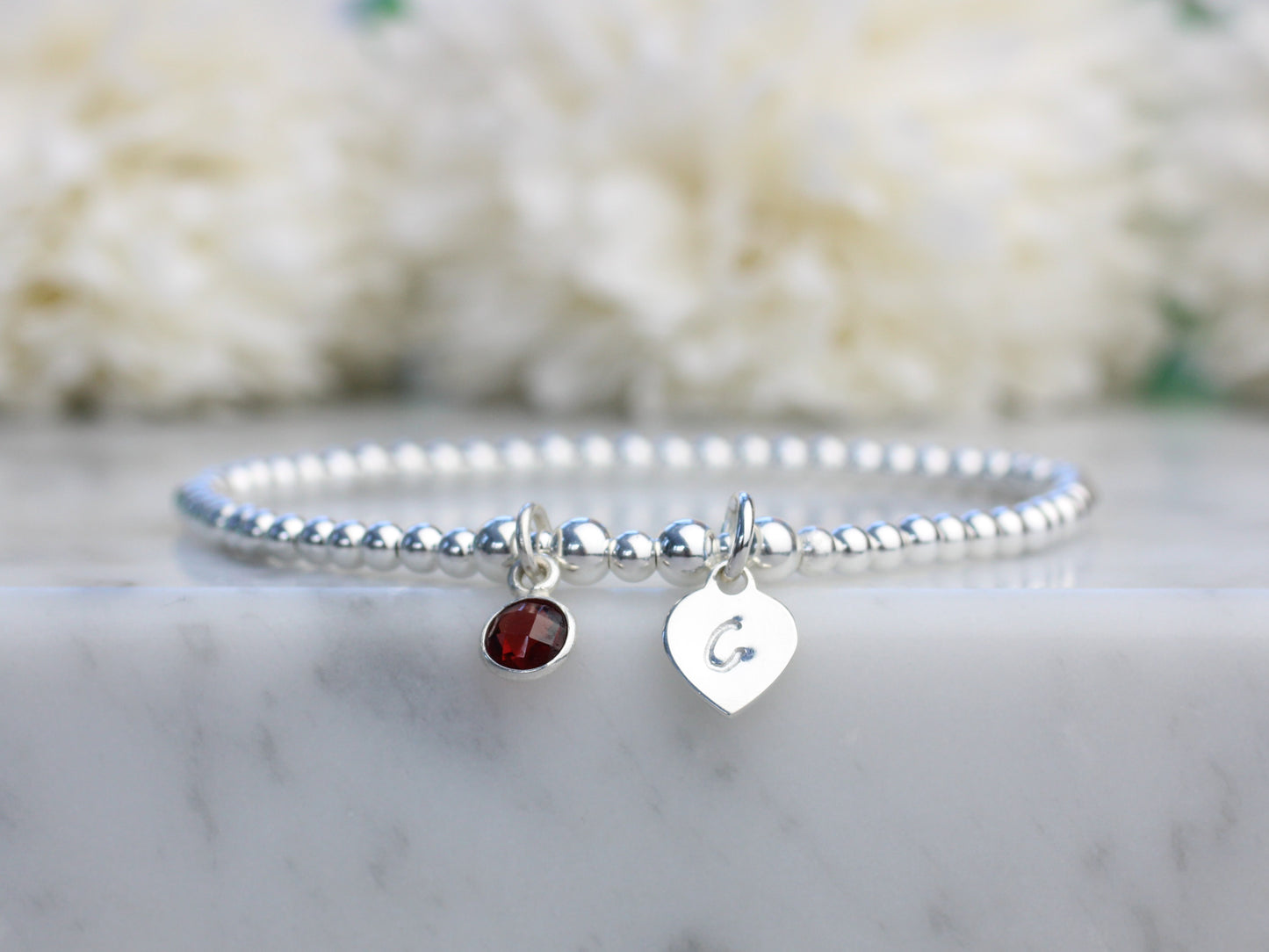 garnet charm and initial bracelet