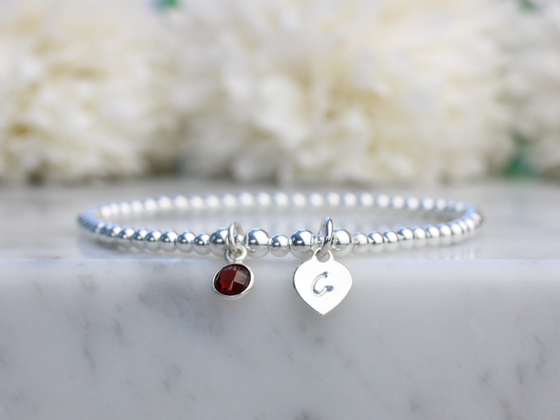 garnet charm and initial bracelet