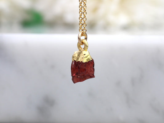 raw garnet necklace in gold