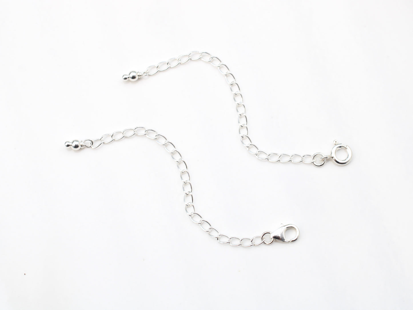 Silver necklace and bracelet extender.
