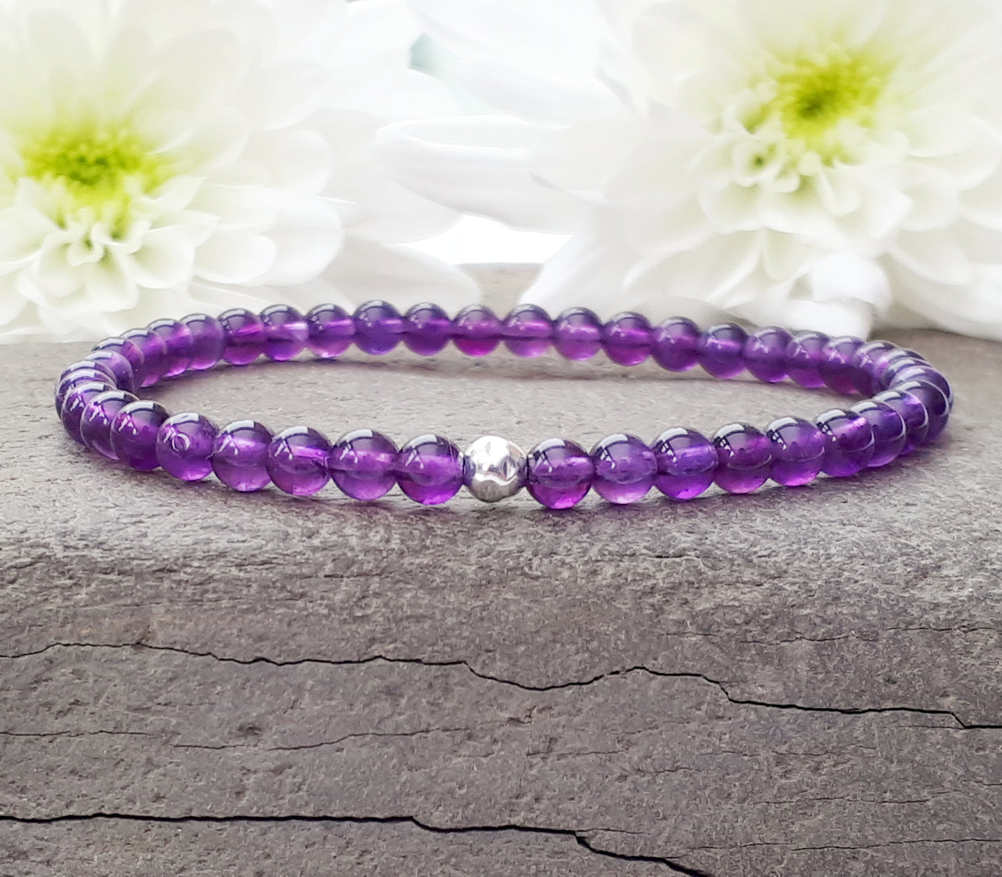 Amethyst bead bracelet with silver accent bead.