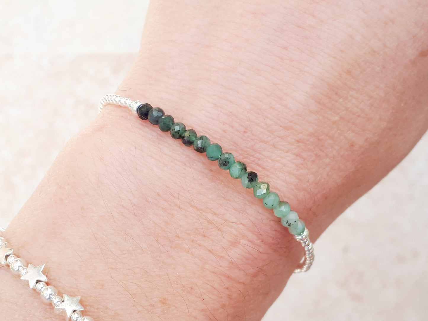 Emerald gemstone bracelet in sterling silver.