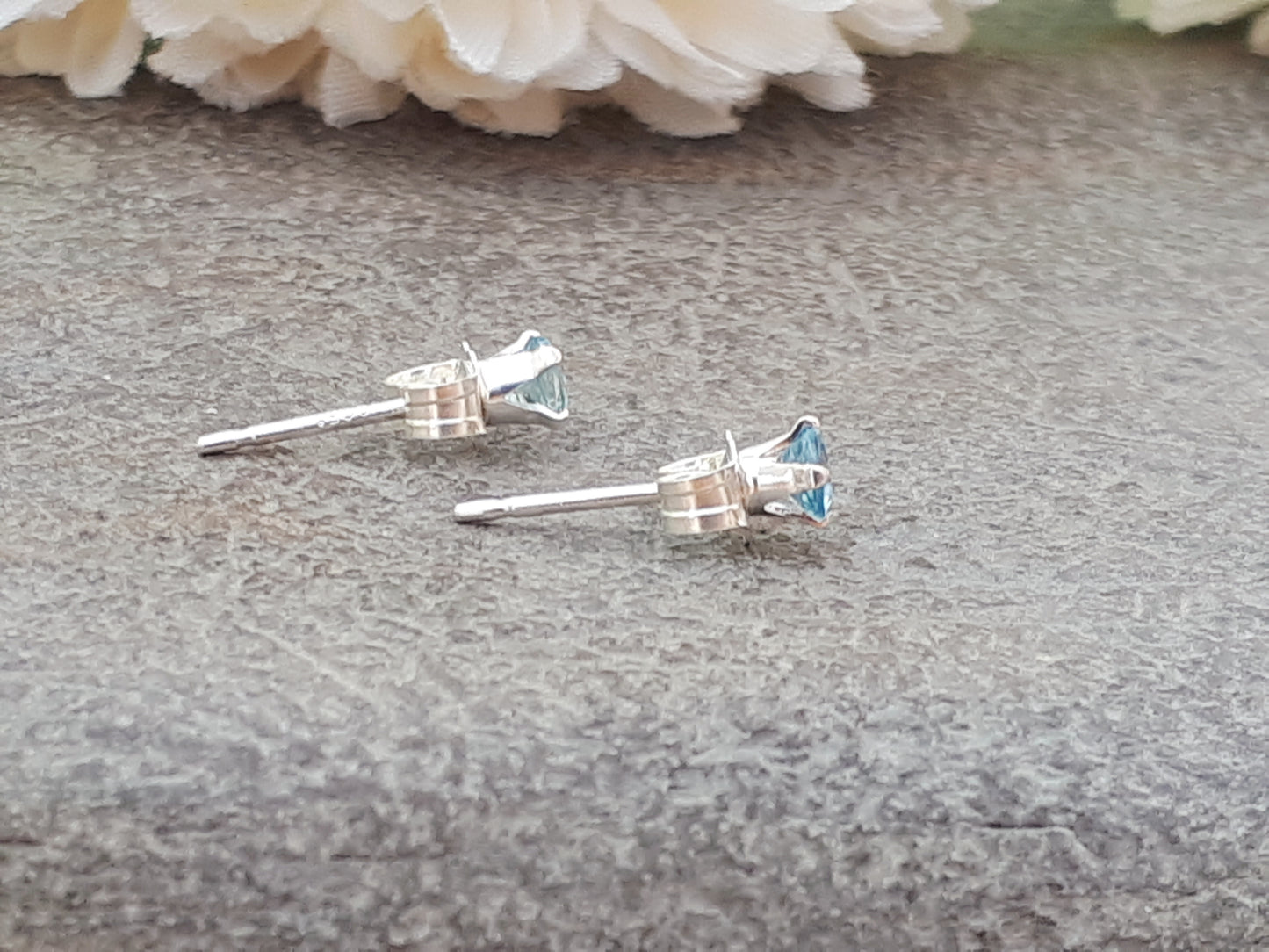 Aquamarine stud earrings in silver or gold.