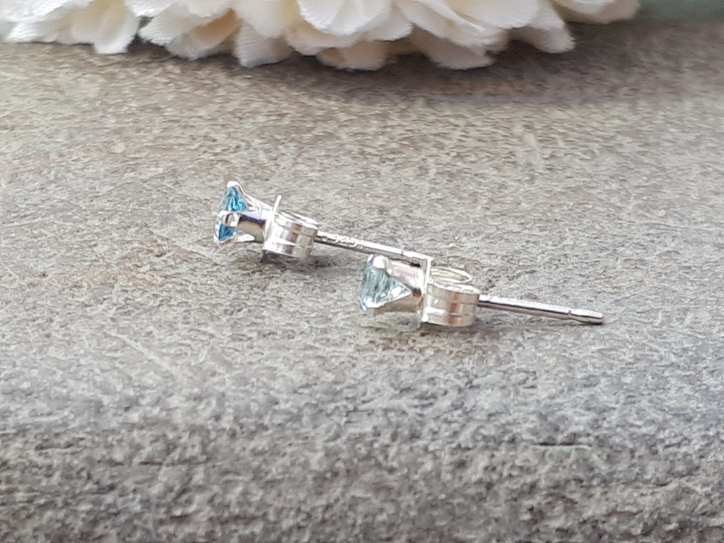 Aquamarine stud earrings in silver or gold.