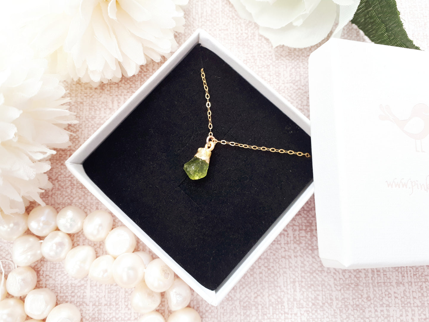 Raw peridot necklace in gold. August birthstone.