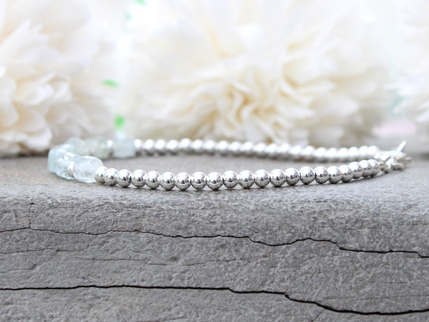 Aquamarine milestone bracelet in sterling silver.