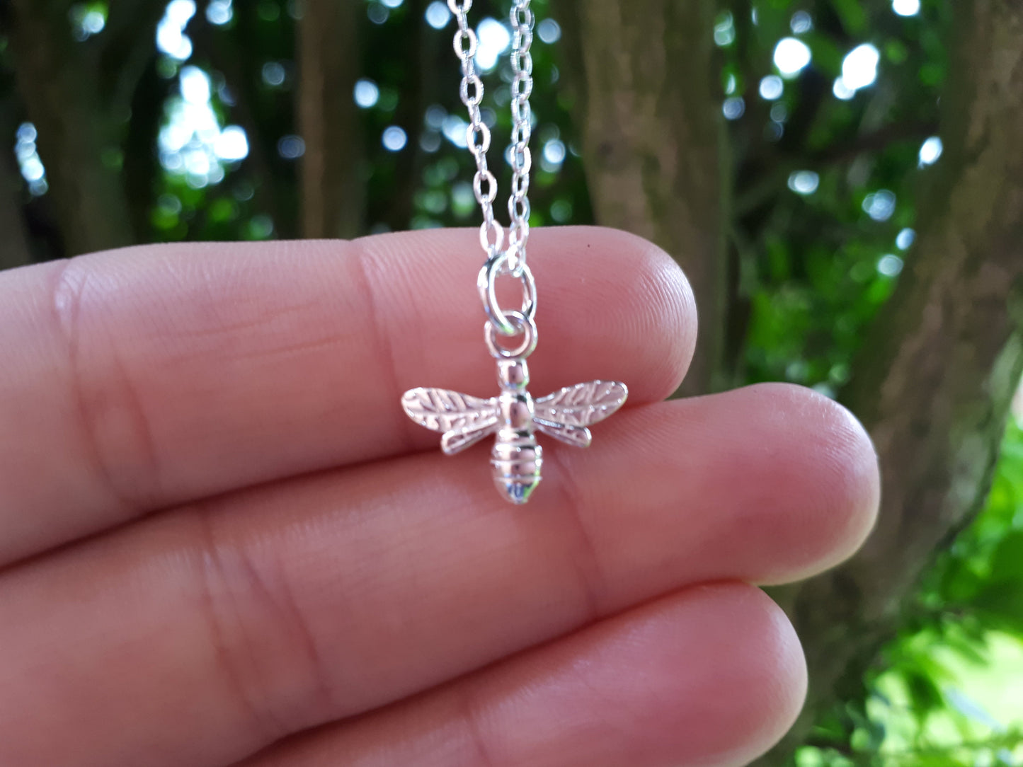 Silver bee necklace.