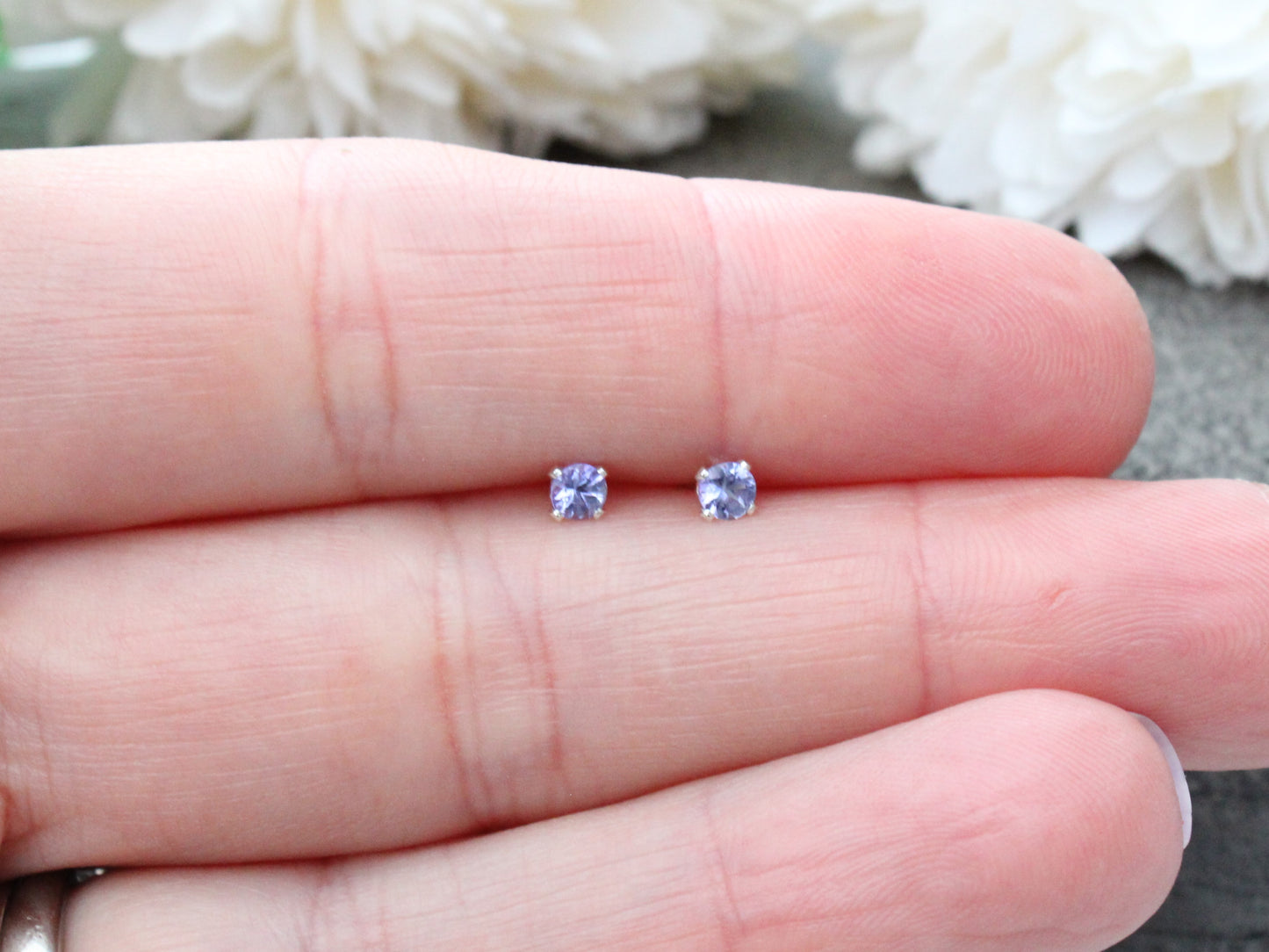 Tanzanite stud earrings in sterling silver or gold.